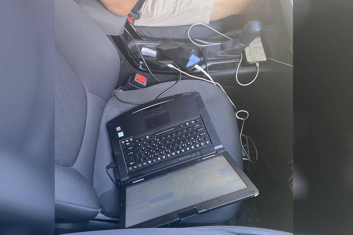 Vancouver Police stopped a driver after he veered into oncoming traffic. Inside the vehicle they found multiple cell phones and an open laptop. (VPD Traffic Services/Twitter)