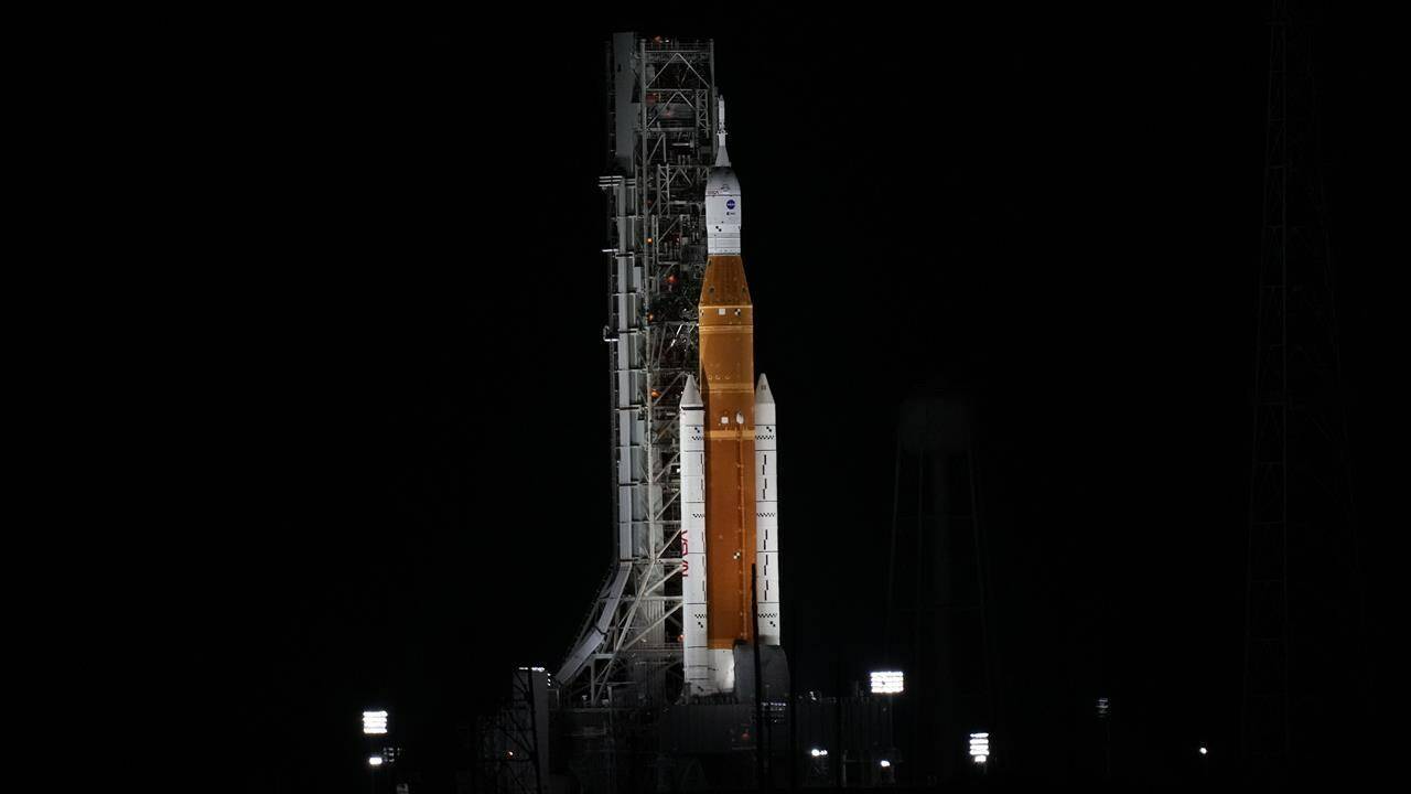 NASA’s new moon rocket is illuminated by xenon lights as she sits on Launch Pad 39-B hours ahead of a planned launch at the Kennedy Space Center Saturday, Sept. 3, 2022, in Cape Canaveral, Fla. This is scheduled to be the first flight of NASA’s 21st-century moon-exploration program, named Artemis after Apollo’s mythological twin sister. (AP Photo/Chris O’Meara)