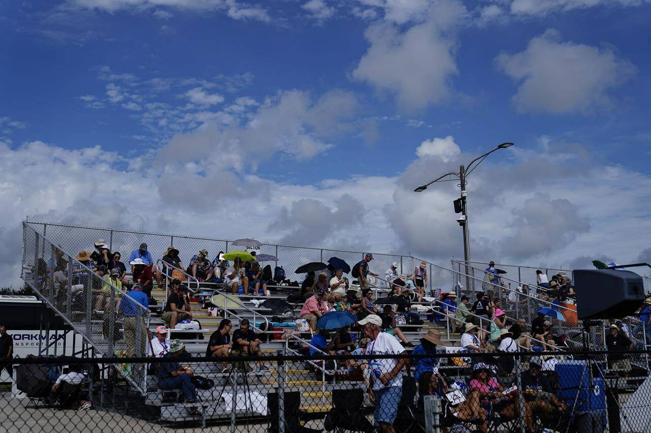 People wait for the NASA moon rocket to launch on Pad 39B before the Artemis 1 mission to orbit the moon at the Kennedy Space Center, Saturday, Sept. 3, 2022, in Cape Canaveral, Fla. NASA’s new moon rocket sprang another dangerous fuel leak Saturday, forcing launch controllers to call off their second attempt to send a crew capsule into lunar orbit with test dummies. (AP Photo/Brynn Anderson)