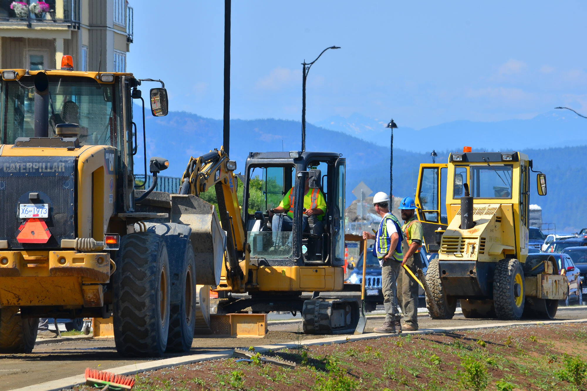 Construction crews work on a highway on Vancouver Island. (Black Press file photo)