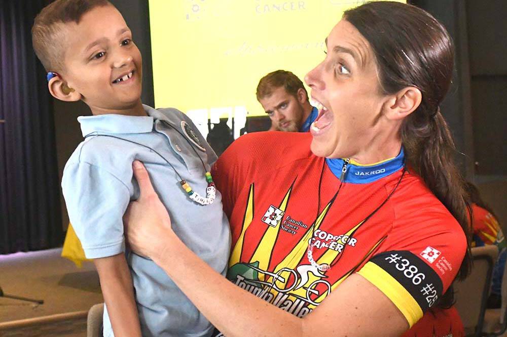 Upper Fraser Valley RCMP Sgt. Krista Vrolyk and Thar hang out in Abbotsford on Wednesday (Sept. 7) during the jersey presentation for participants in the Cops for Cancer Tour de Valley. (John Morrow/Abbotsford News).