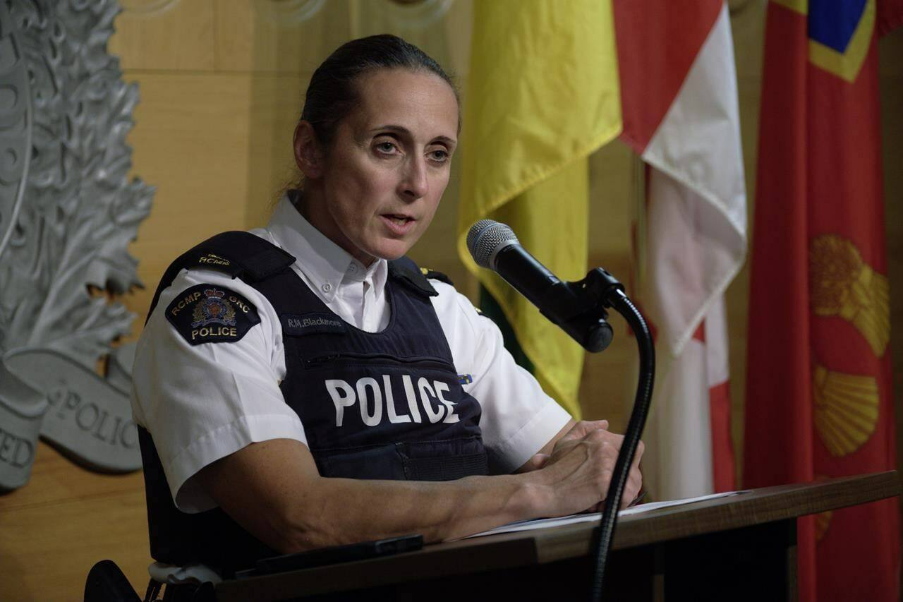 Assistant Commissioner Rhonda Blackmore speaks during a press conference at RCMP “F” Division Headquarters in Regina on Wednesday Sept. 7, 2022. RCMP say a special unit dedicated to apprehending fugitives was not actively searching for a Saskatchewan man they say is responsible for a stabbing rampage that left 11 people dead and 18 others injured. THE CANADIAN PRESS/Michael Bell