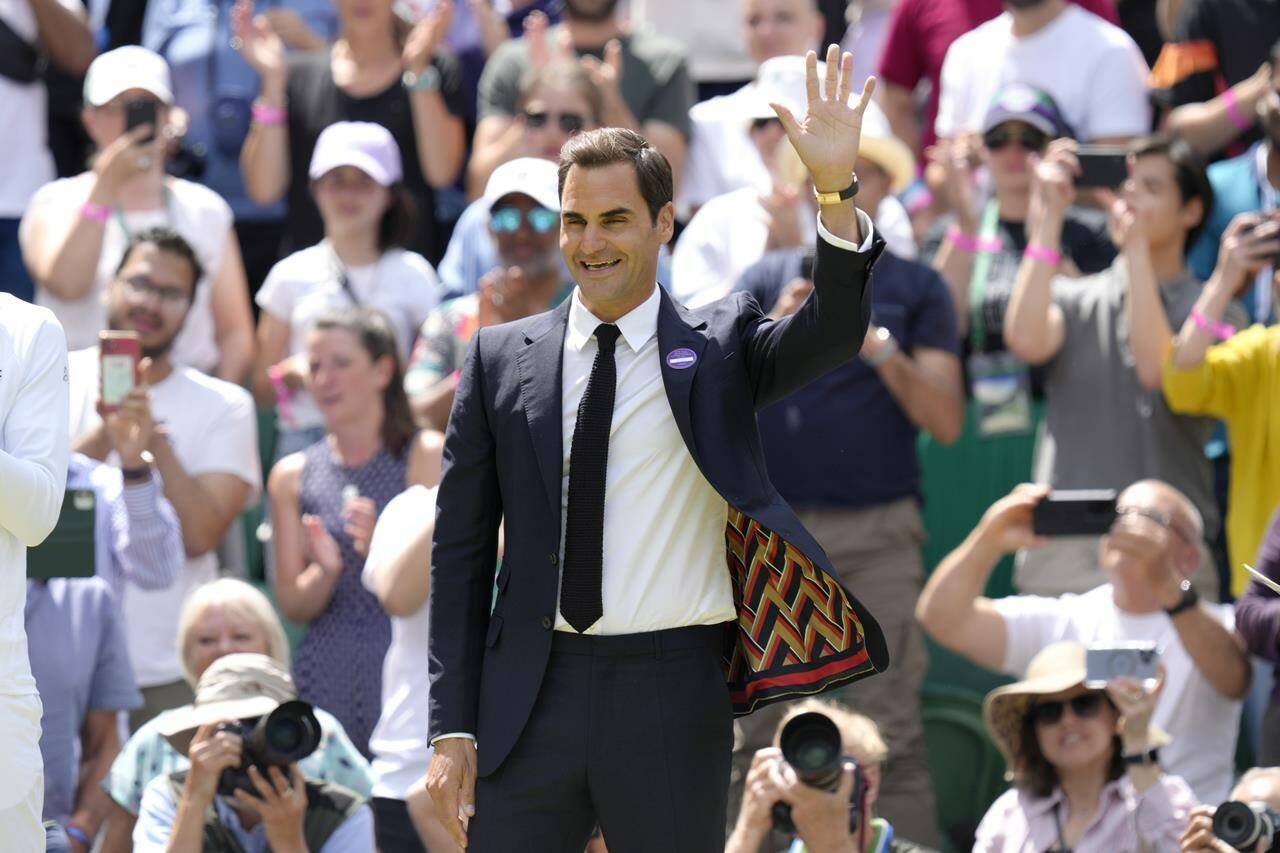 FILE - Switzerland’s Roger Federer waves during a 100 years of Centre Court celebration on day seven of the Wimbledon tennis championships in London, on July 3, 2022. Federer announced Thursday, Sept. 15, 2022 he is retiring from tennis. (AP Photo/Kirsty Wigglesworth, File)