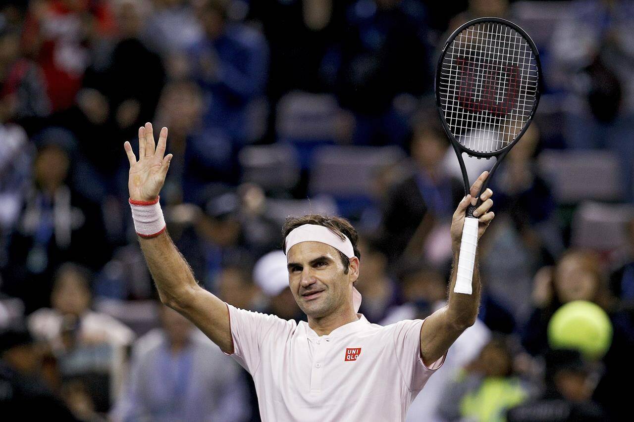 FILE - Roger Federer of Switzerland waves to spectators after defeating Daniil Medvedev of Russia in their men’s singles match of the Shanghai Masters tennis tournament at Qizhong Forest Sports City Tennis Center in Shanghai, China, Oct. 10, 2018. Federer announced Thursday, Sept. 15, 2022 he is retiring from tennis. (AP Photo/Andy Wong, File)