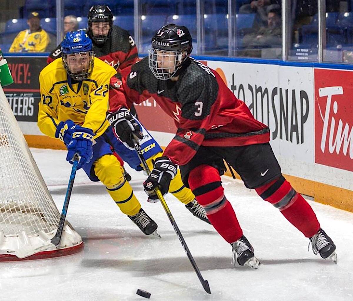 Canadian and Swedish hockey players in a photo featured in the 86-page 2022 World Under-17 Hockey Challenge guide and record book posted to the website hockeycanada.ca.