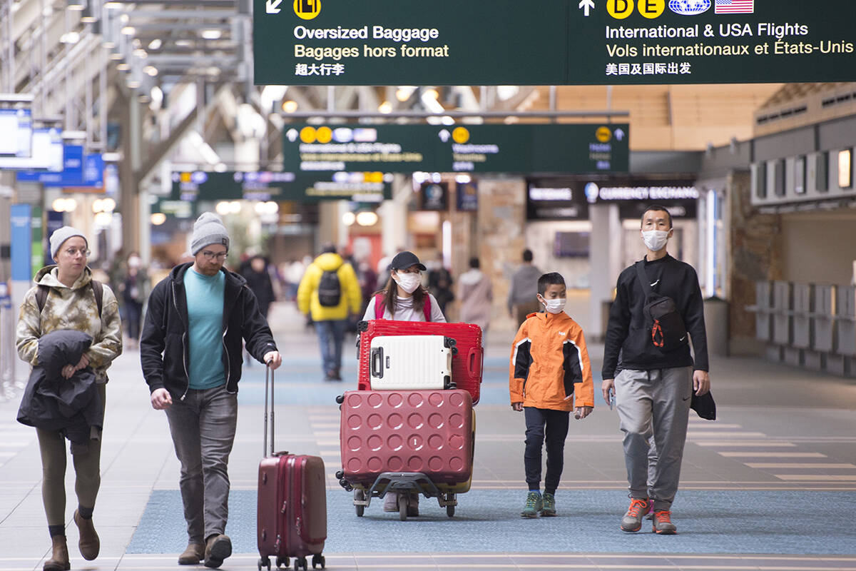 Travellers at Vancouver International Airport in Richmond. The aviation industry faces significant challenges, delegates at the 2022 Union of British Columbia Municipalities Convention heard. (THE CANADIAN PRESS/Jonathan Hayward)