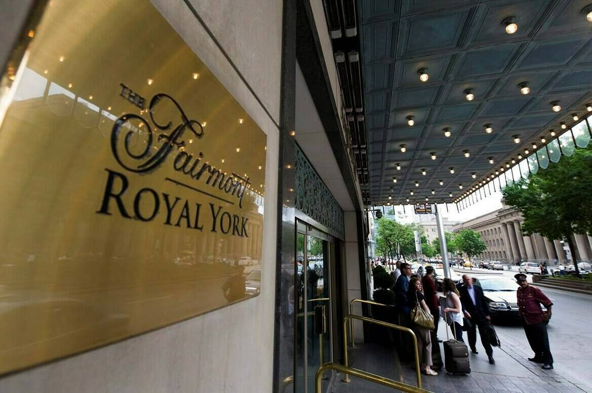 Doormen work at the Royal York Hotel in Toronto on Thursday, June 3, 2010. Real estate firm CBRE says Canadian hotels will return to pre-pandemic revenues next year, two years ahead of its previous forecast. THE CANADIAN PRESS/Adrien Veczan