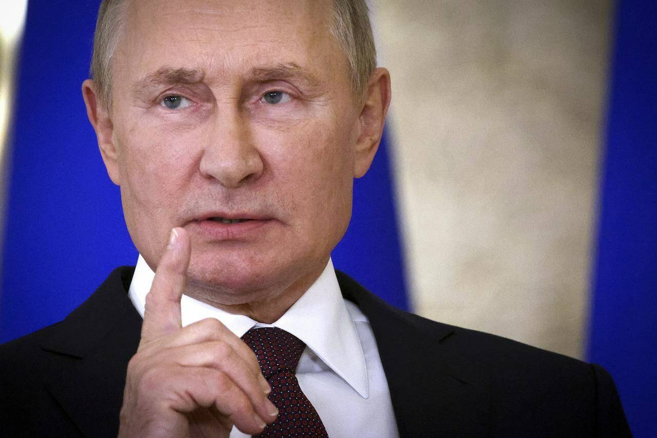 Russian President Vladimir Putin gestures as he speaks to the media after the Shanghai Cooperation Organisation (SCO) summit in Samarkand, Uzbekistan, Friday, Sept. 16, 2022. (Sergei Bobylev, Sputnik, Kremlin Pool Photo via AP)