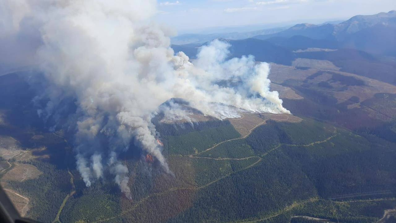The Battleship Mountain wildfire burns in the Prince George Fire Centre in this Thursday, Sept. 15, 2022 handout photo. An evacuation order for B.C.s largest wildfire has been rescinded, though the BC Wildfire Service reporting the blaze remains out of control. THE CANADIAN PRESS/HO, BC Wildfire Service