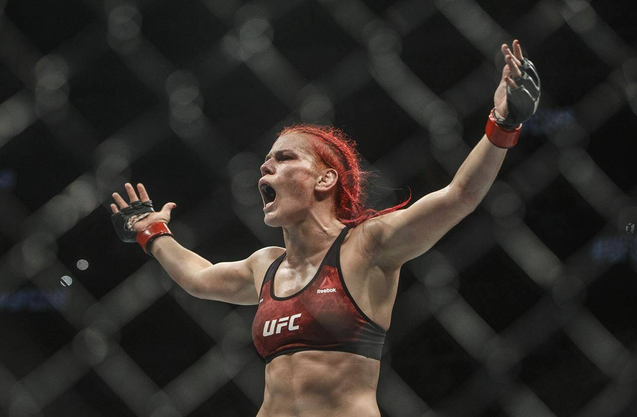 Gillian (The Savage) Robertson celebrates her win over Sarah Frota during UFC 240, in Edmonton on Saturday, July 27, 2019. Canadian flyweight Gillian (The Savage) Robertson survived a first-round beating to submit Kazakhstan’s Mariya (Demonslayer) Agapova on a UFC Fight Night card Saturday. THE CANADIAN PRESS/Jason Franson