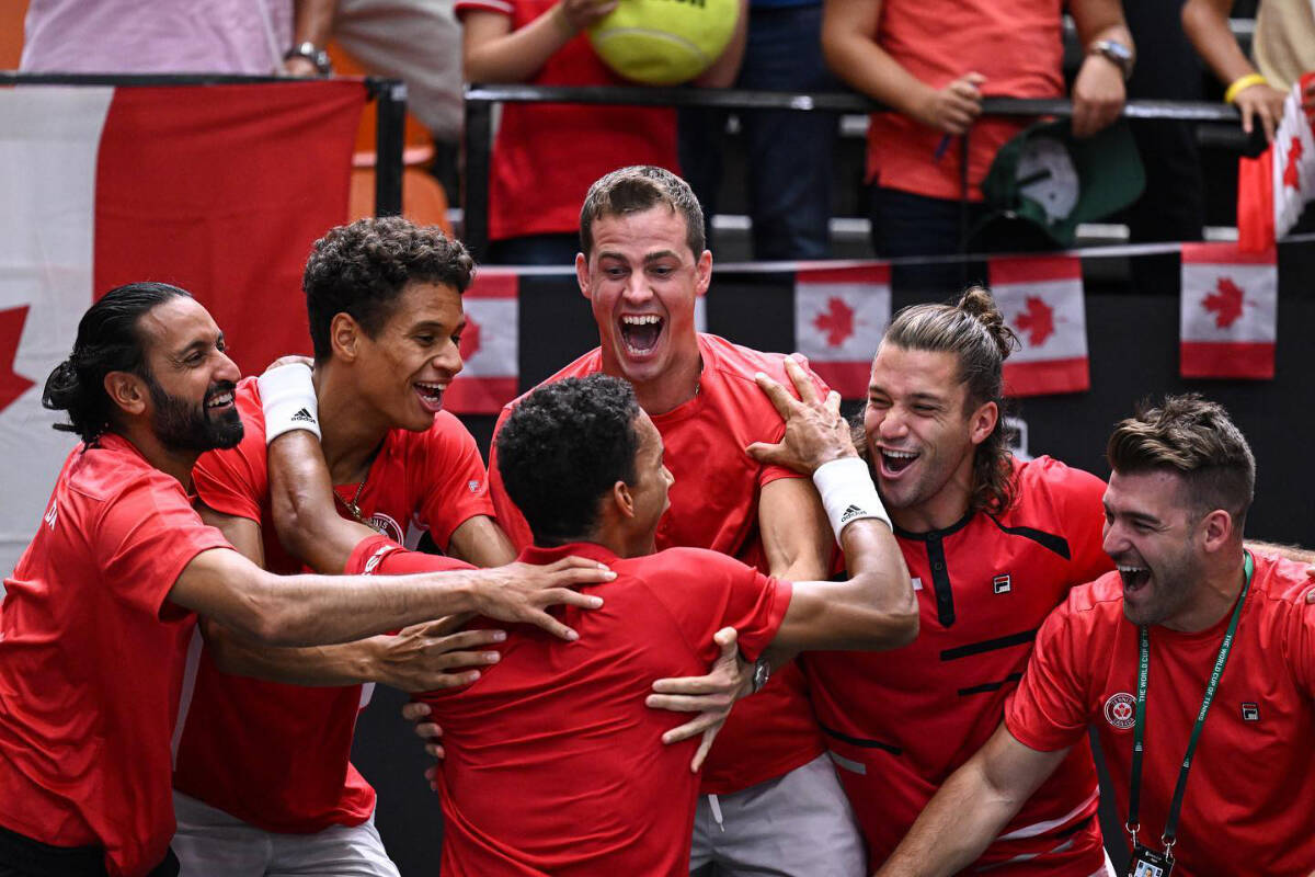 Vernon’s Vasek Pospisil (centre) and Team Canada celebrate Montreal’s Felix Auger-Aliassime stunning win over world No. 1 Carlos Alcaraz of the host country in Davis Cup action Friday, Sept. 16, Spain. (Facebook photo)