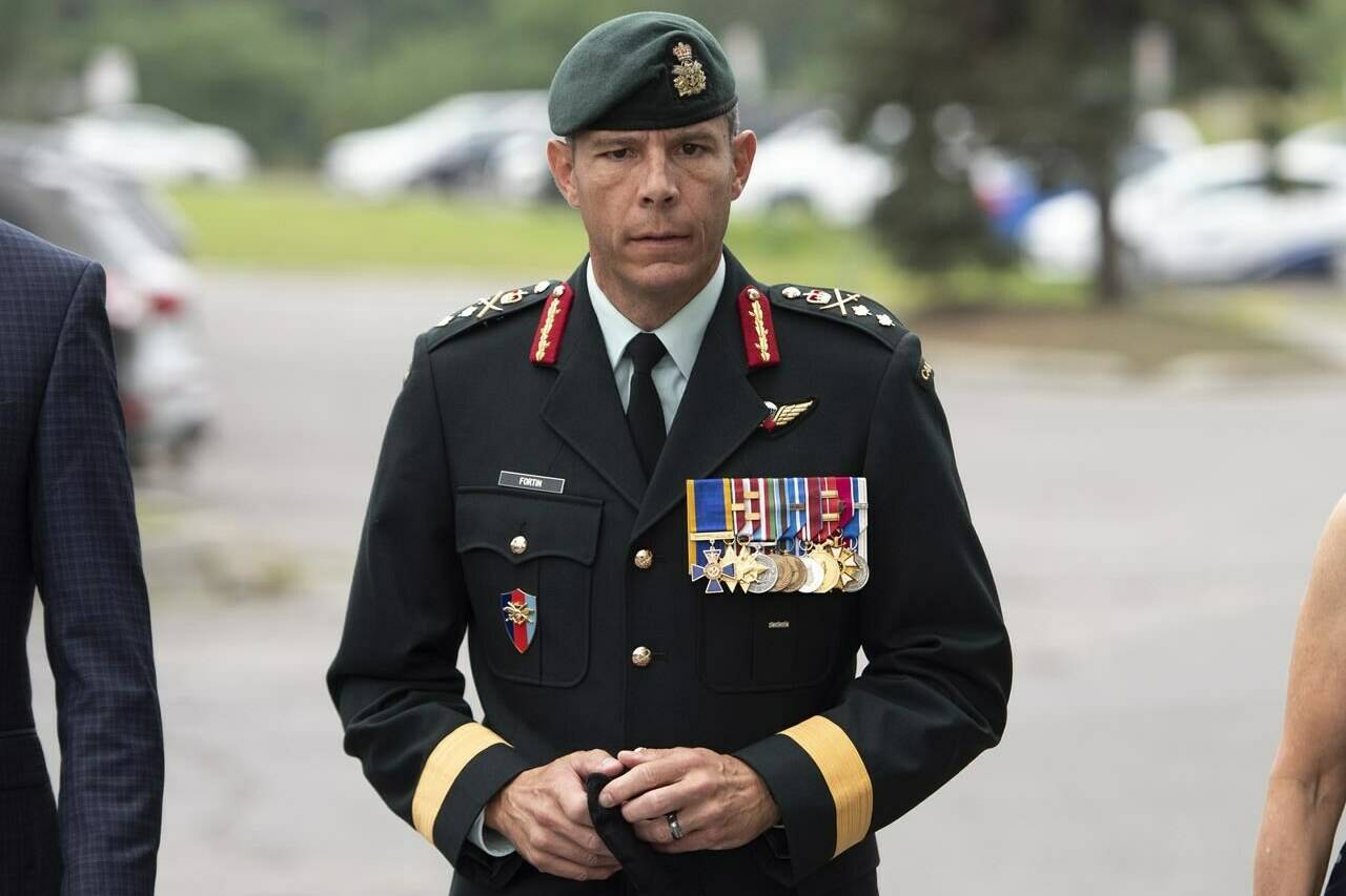 Maj.-Gen. Dany Fortin arrives to be processed at the Gatineau Police Station in Gatineau, Que., on Wednesday, Aug. 18, 2021. Fortin’s sexual assault trial is scheduled to begin in a Gatineau courthouse this morning. THE CANADIAN PRESS/Justin Tang