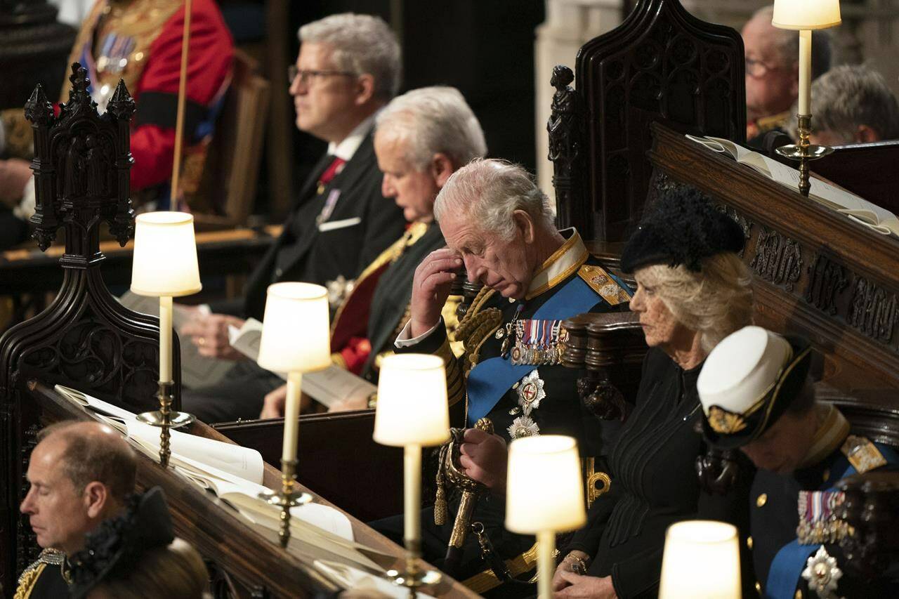 King Charles III, center, attend the committal service for Britain's Queen Elizabeth II at St George's Chapel, Windsor Castle, in Windsor, England, Monday, Sept. 19, 2022. (Joe Giddens/Pool Photo via AP)