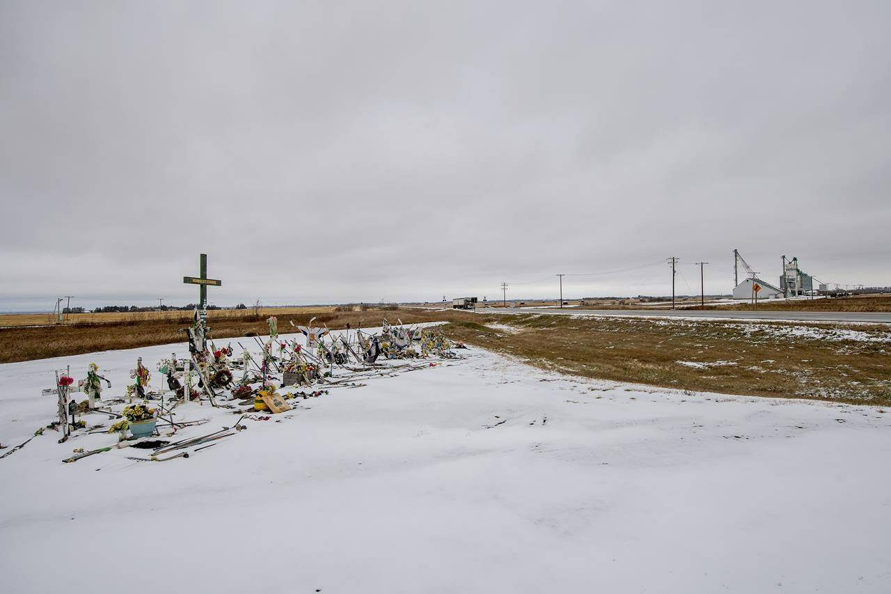 A memorial for the fatal bus crash involving the Humboldt Broncos hockey team at the intersection of Highways 35 and 335 near Tisdale, Tuesday, Oct. 27, 2020. The Saskatchewan Court of Appeal has set aside a temporary injunction preventing a lawsuit filed by a some of the parents of those who died in the crash from going ahead.THE CANADIAN PRESS/Liam Richards
