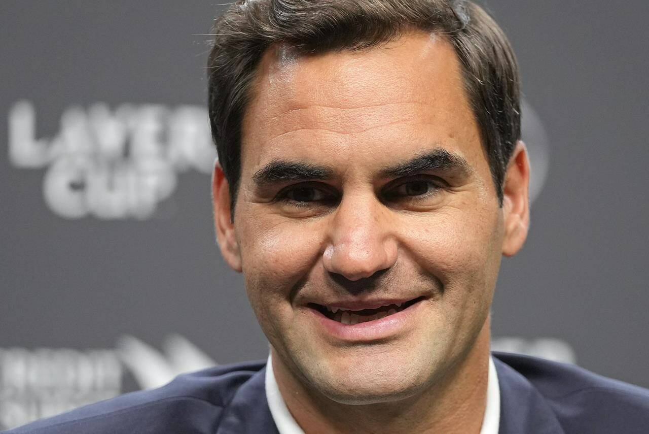 Switzerland’s Roger Federer smiles during a media conference ahead of the Laver Cup tennis tournament at the O2 in London, Wednesday, Sept. 21, 2022. Federer will meet with the media Wednesday to discuss walking away from the game at age 41 after 20 Grand Slam titles. (AP Photo/Kin Cheung)