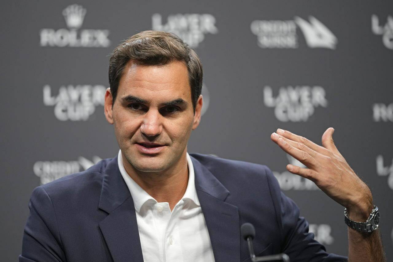 Switzerland’s Roger Federer gestures during a media conference ahead of the Laver Cup tennis tournament at the O2 in London, Wednesday, Sept. 21, 2022. Federer will meet with the media Wednesday to discuss walking away from the game at age 41 after 20 Grand Slam titles. (AP Photo/Kin Cheung)