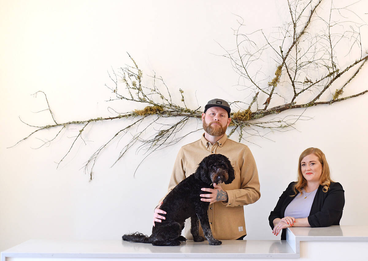 Sara Edge and Daniel Martin with their dog Pippa  in their Nanaimo store Hoxton Home.  Don Denton photo.