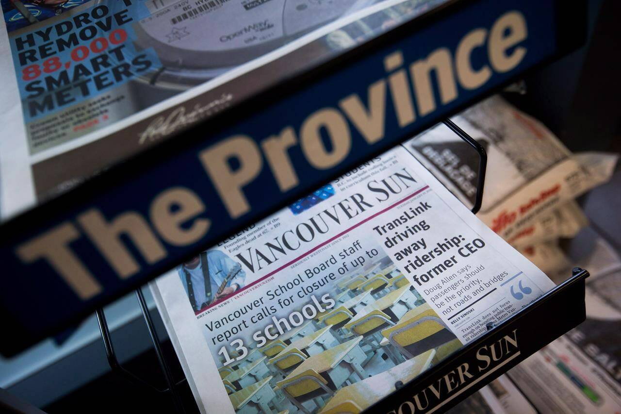 Copies of Postmedia-owned newspapers the Vancouver Sun and The Province are displayed at a store in Burnaby, B.C., on Tuesday January 19, 2016. THE CANADIAN PRESS/Darryl Dyck