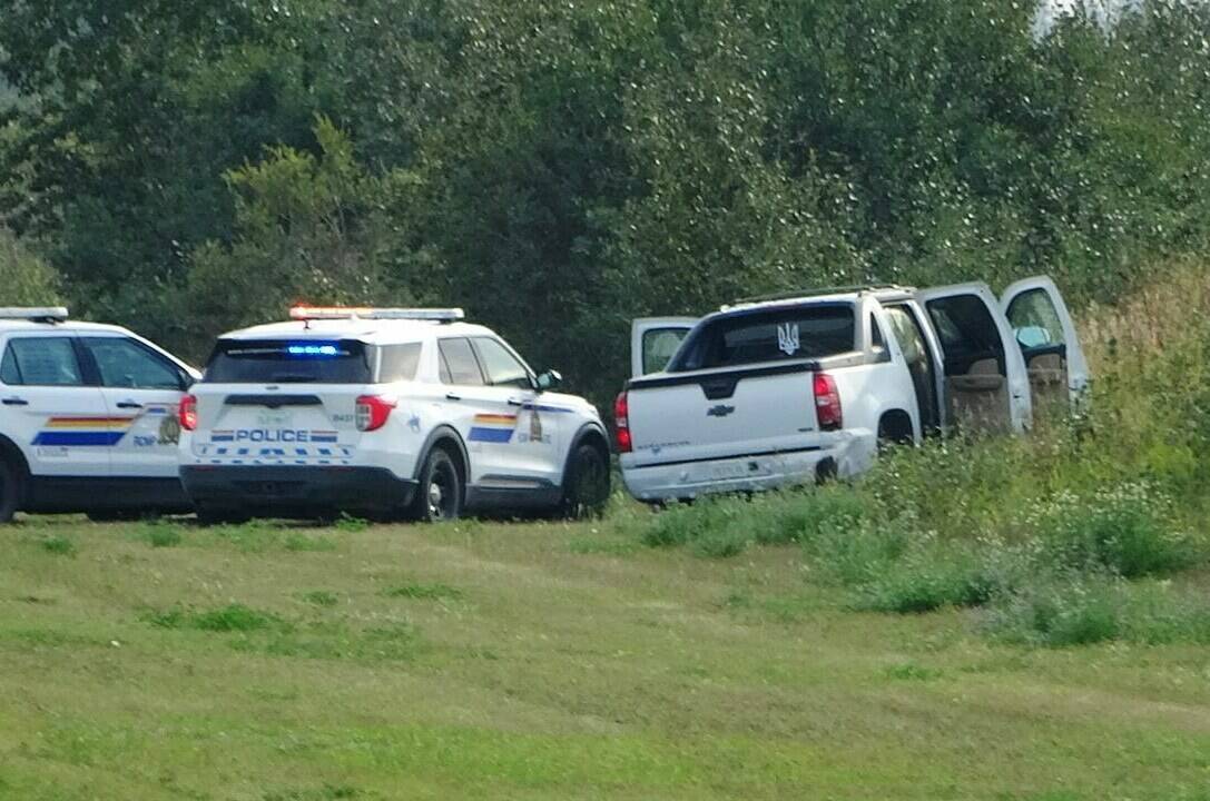 Police and investigators are seen at the side of the road outside Rosthern, Sask., on Wednesday, Sept. 7, 2022. Saskatchewan’s chief coroner says two public inquests are to be held following a deadly stabbing rampage northeast of Saskatoon earlier this month.THE CANADIAN PRESS/Kelly Geraldine Malone