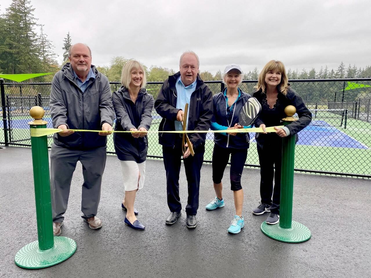 Surrey Mayor Doug McCallum and council members celebrate the opening of new pickleball courts at Crescent Park on Sept. 15 alongside Lorraine Subtelny of South Surrey’s Heavy Dinkers Pickleball Club. (Submitted photo)