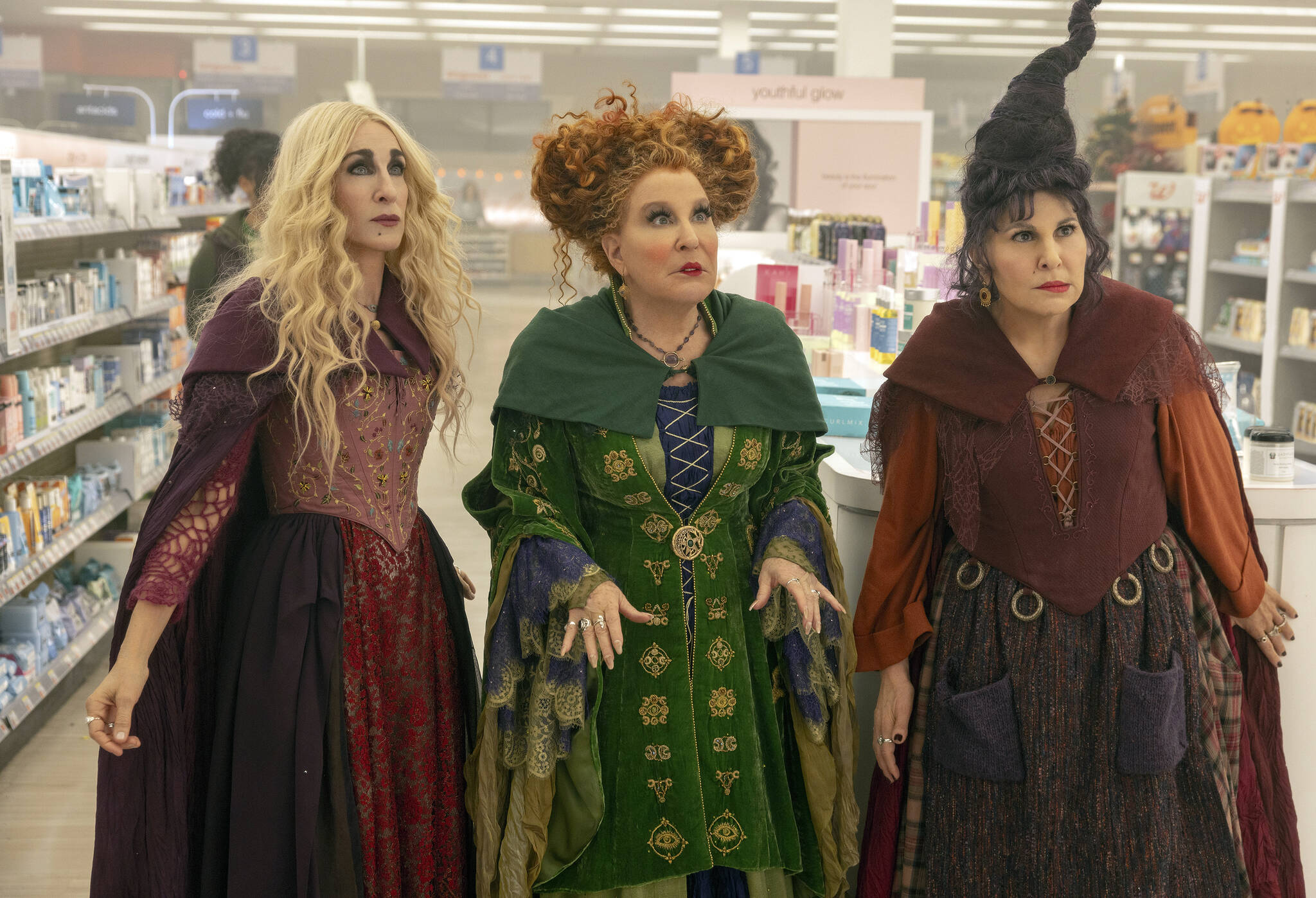 This image released by Disney shows, from left, Sarah Jessica Parker as Sarah Sanderson, Bette Midler as Winifred Sanderson, and Kathy Najimy as Mary Sanderson in “Hocus Pocus 2.” (Matt Kennedy/Disney via AP)