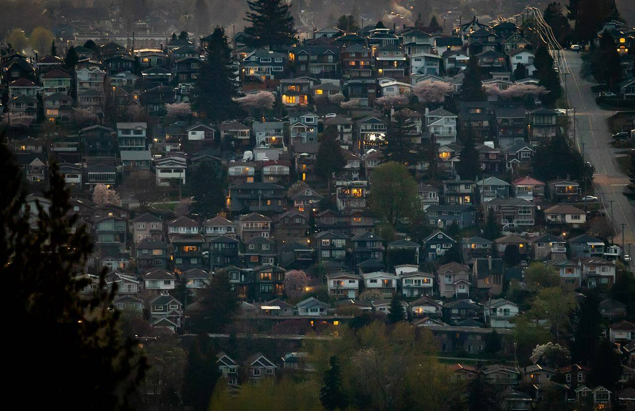 Houses are seen on a hillside in Burnaby, B.C., on Saturday, April 17, 2021. The Real Estate Board of Greater Vancouver says September’s homes sales dropped by 46 per cent since last year and 10 per cent from August. THE CANADIAN PRESS/Darryl Dyck