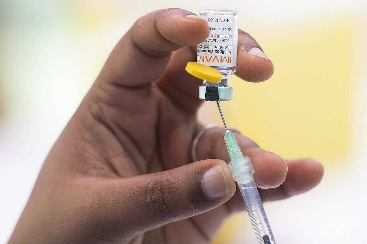 A health-care worker prepares monkeypox vaccine in Montreal on July 23, 2022. Second doses of the monkeypox vaccine will be available to British Columbians starting this week. THE CANADIAN PRESS/Graham Hughes