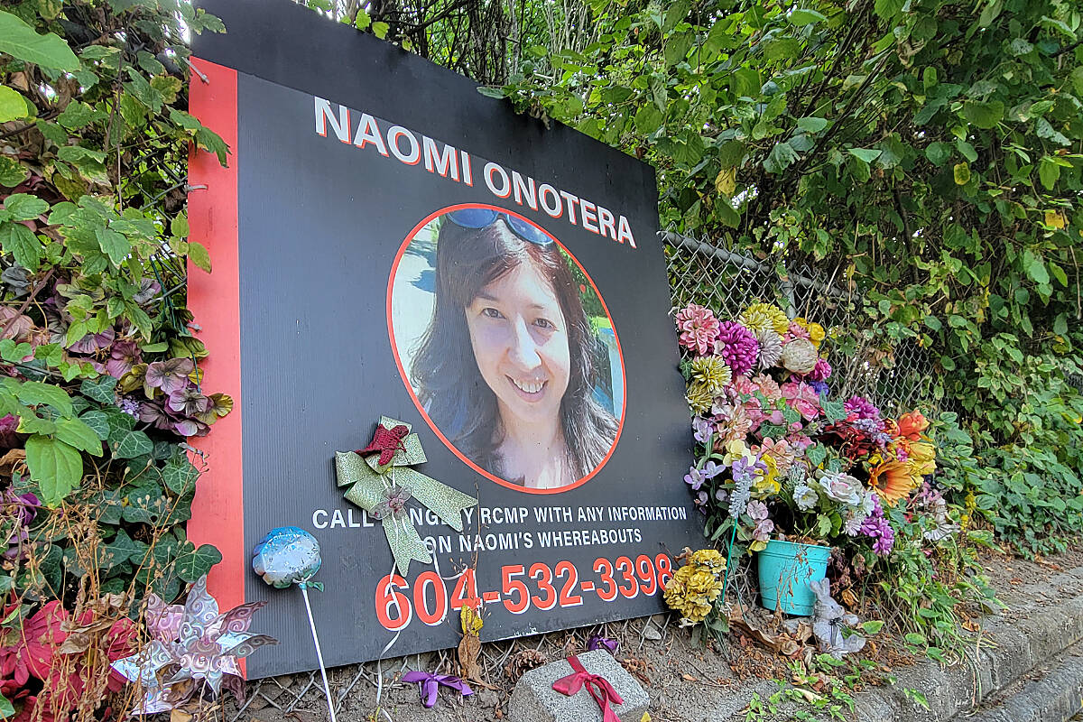 A memorial remains outside the home of Langley City homicide victim Naomi Onotera, who died in 2021. On Monday, Oct. 3, online ads to sell the house on 200th Street were posted. (Dan Ferguson/Langley Advance Times)