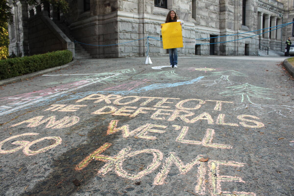 Melanie Murray was one of the demonstrators who showed up outside the B.C. legislature on Oct. 3, the first day of the fall session, to call for an end to old-growth logging. (Jake Romphf/News Staff)