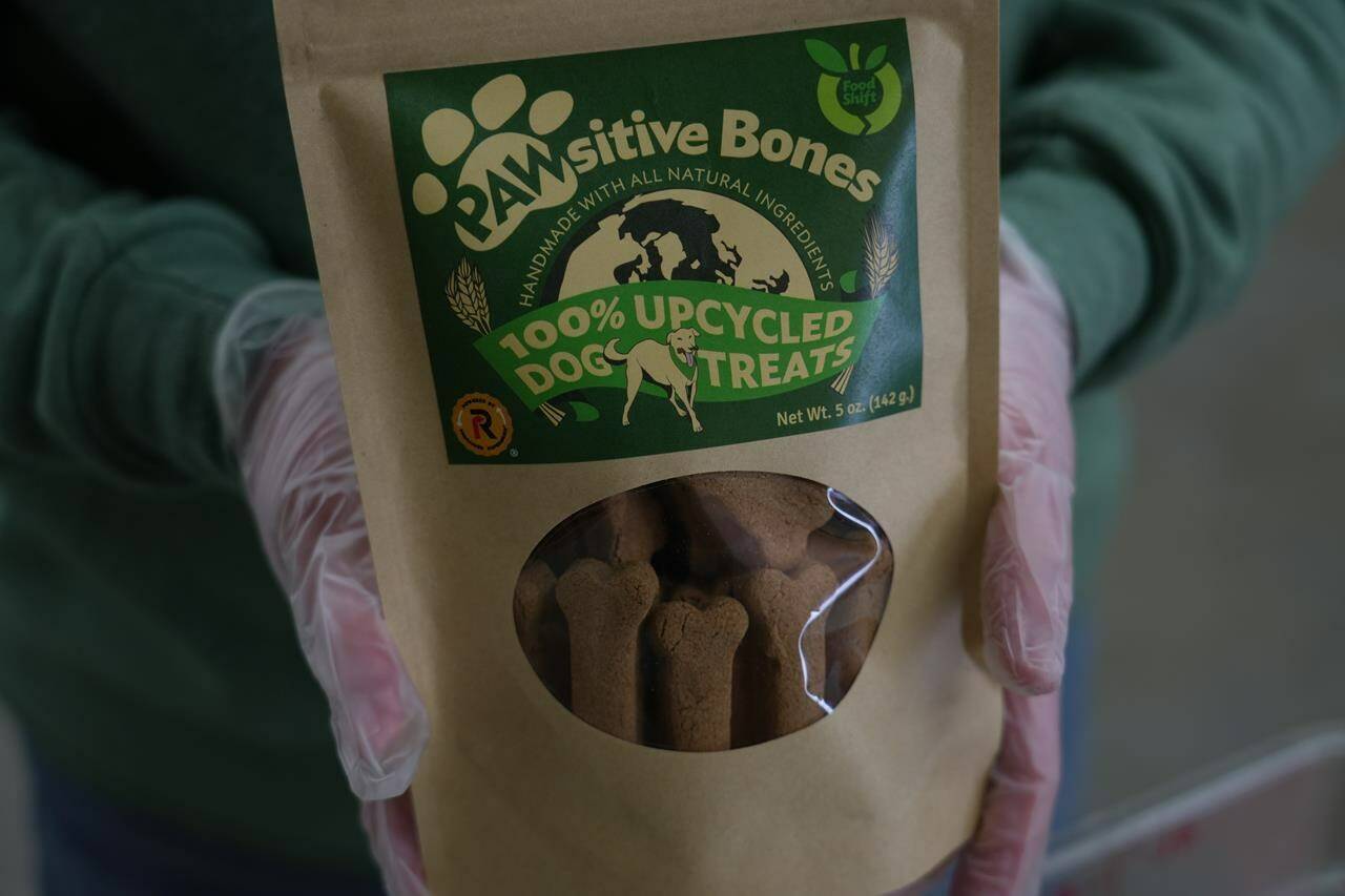 A package of Pawsitive Bones, a dog treat, produced by Food Shift, made of ingredients that are usually discarded, is shown Tuesday, Sept. 13, 2022 in Alameda, California. “Best before” labels are coming under scrutiny as concerns about food waste grow around the world. Manufacturers have used the labels for decades to estimate peak freshness. But “best before” labels have nothing to do with safety, and some worry they encourage consumers to throw away food that’s perfectly fine to eat. (AP Photo/Terry Chea)