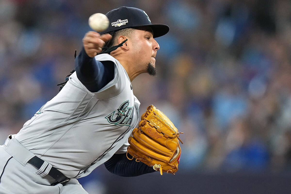 Seattle Mariners starting pitcher Luis Castillo (21) pitches against the Toronto Blue Jays during third inning American League wild card MLB postseason baseball action in Toronto on Friday, October 7, 2022. THE CANADIAN PRESS/Nathan Denette