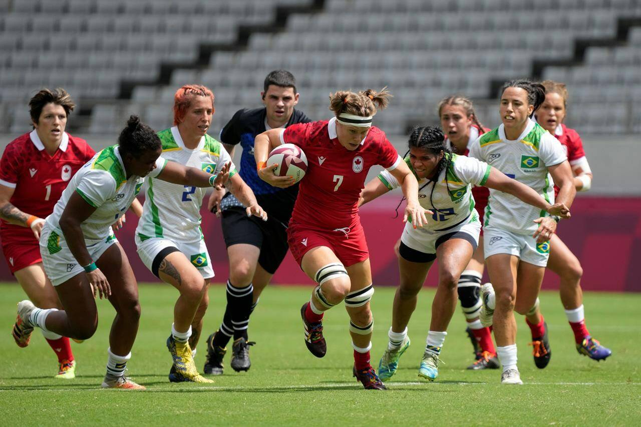 Canada’s Karen Paquin, center, is pursued by Brazil’s, from left, Mariana Nicolau, Luiza Campos, and Thalita da Silva Costa, in their women’s rugby sevens match at the 2020 Summer Olympics, Thursday, July 29, 2021 in Tokyo, Japan. Tyson Beukeboom, Karen Paquin and Elissa Alarie kick off their third Rugby World Cup on Saturday when third-ranked Canada takes on No. 13 Japan in Pool B play at Northland Events Centre in Whangarei, New Zealand.THE CANADIAN PRESS/AP, Shuji Kajiyama