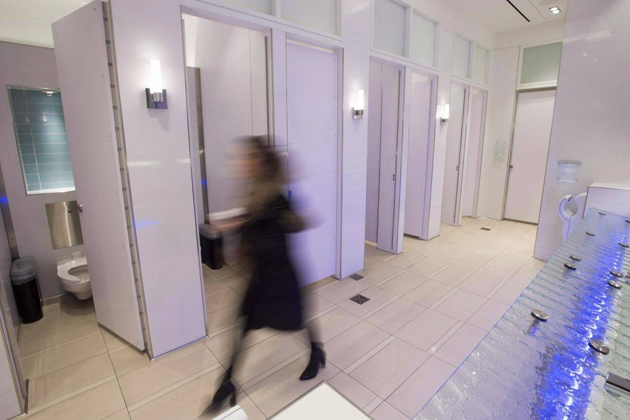 A woman walks in an all-gender washroom at Yorkdale Mall in Toronto on Tuesday, Dec. 11, 2018. THE CANADIAN PRESS/Frank Gunn