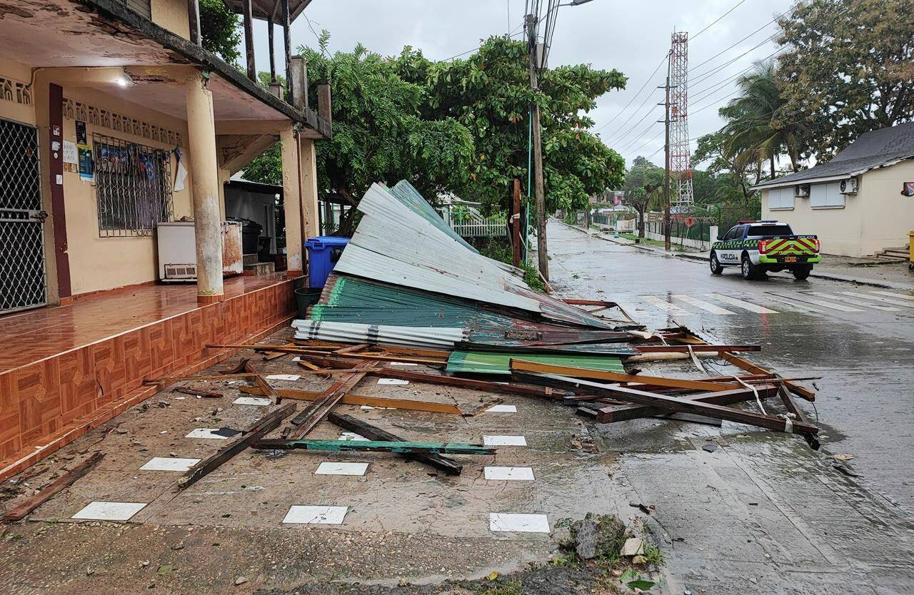 A police car drives by debris thrown in the aftermath of Hurricane Julia in San Andres island, Colombia, Sunday, Oct.9, 2022. Hurricane Julia hit Nicaragua’s central Caribbean coast on Sunday after lashing Colombia’s San Andres island, and a weakened storm was expected to emerge over the Pacific. (AP Photo/Daniel Parra)