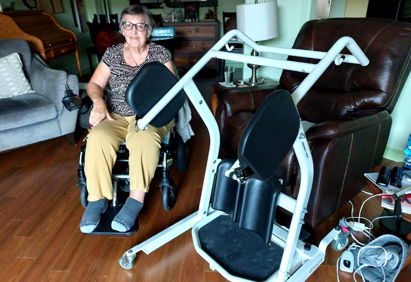 Pamela Garrity, 77, has been confined to a wheelchair since falling out of bed in late September, and relies on a Sarastand (right) to get in and out of bed, get on and off the toilet and do other things. (Eric J. Welsh/ The Progress)