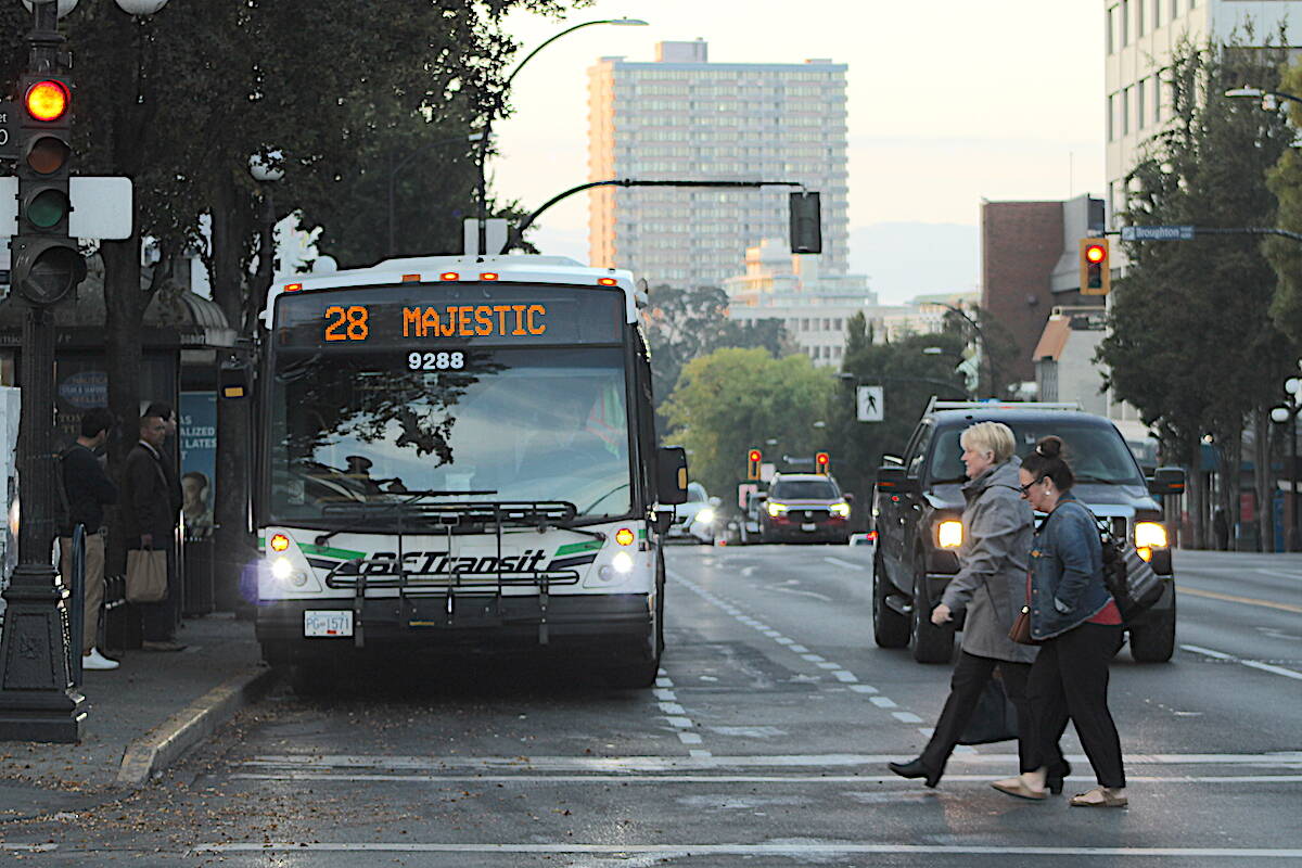 A BC Transit bus picks up passengers from a Douglas Street stop during the morning commute on Oct. 5. (Jake Romphf/New Staff)