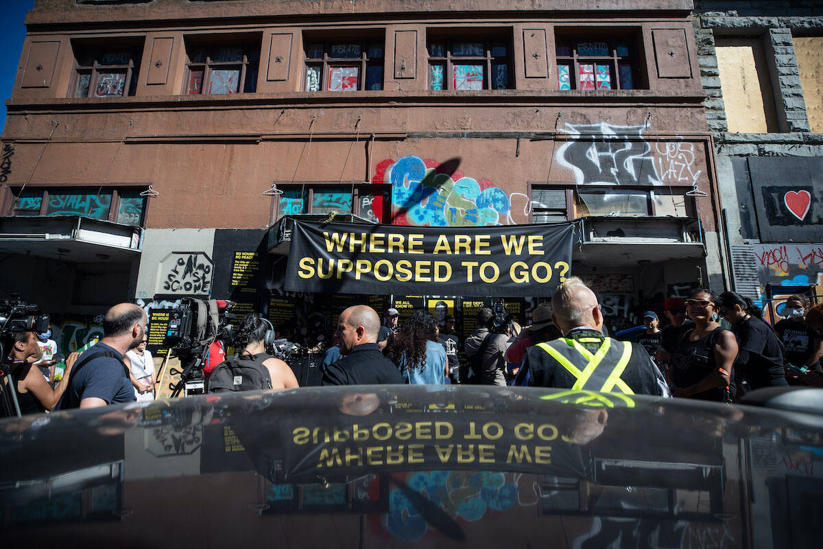 FILE – Indigenous organizations, tent city residents and others hold a news conference outside the former single room occupancy Balmoral Hotel to protest the city’s ongoing removal of a homeless encampment on the sidewalks in the Downtown Eastside of Vancouver, on Tuesday, August 16, 2022. THE CANADIAN PRESS/Darryl Dyck