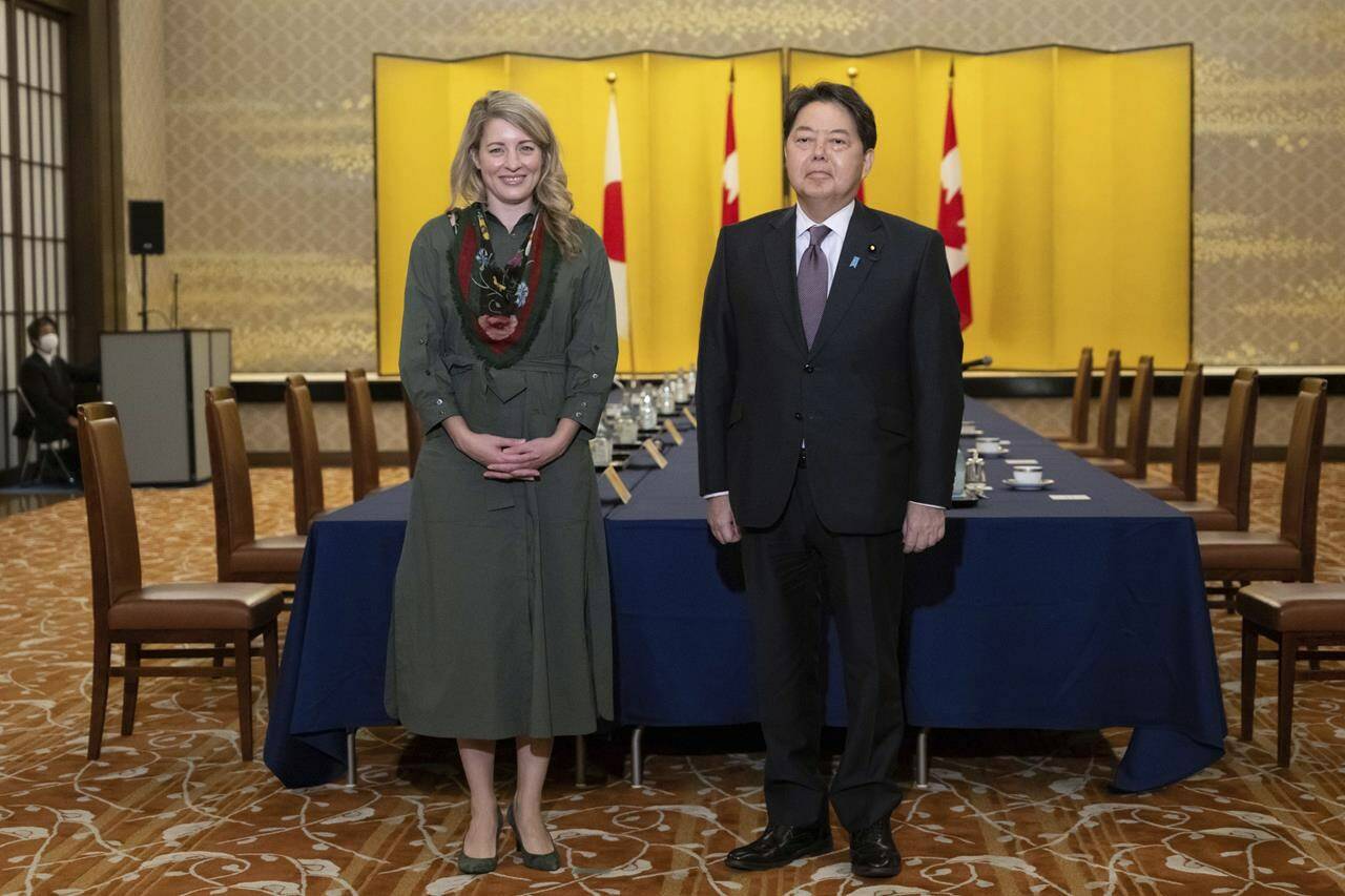 Canadian Foreign Minister Melanie Joly and Japanese Foreign Minister Yoshimasa Hayashi pose for media prior to their meeting at the Iikura Guest House in Tokyo, Tuesday, Oct. 11, 2022. THE CANADIAN PRESS/.AP-Yuichi Yamazaki/Pool Photo via AP
