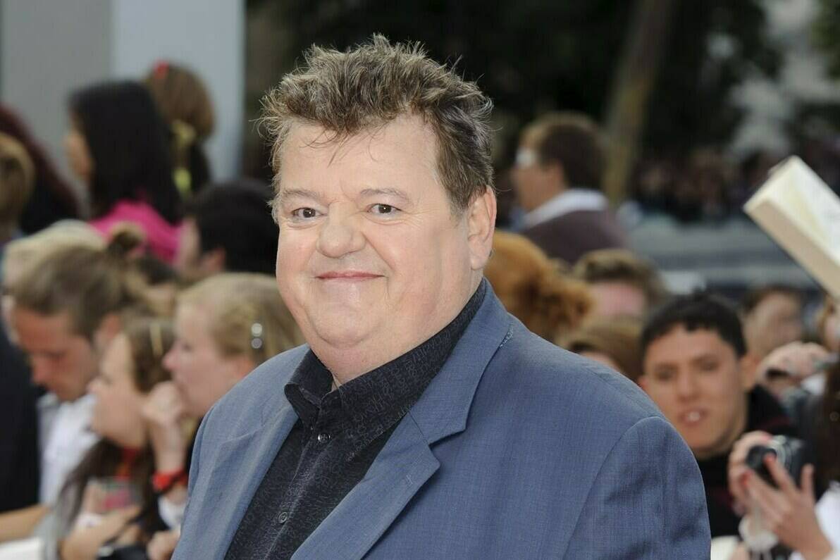FILE - Robbie Coltrane arrives in Trafalgar Square, central London, for the world premiere of “Harry Potter and The Deathly Hallows: Part 2,” the last film in the series on July 7, 2011. Coltrane, who played a forensic psychologist on TV series “Cracker” and Hagrid in the “Harry Potter” movies, has died. Coltrane’s agent Belinda Wright said he died Friday at a hospital in Scotland. He was 72. (AP Photo/Jonathan Short, File)