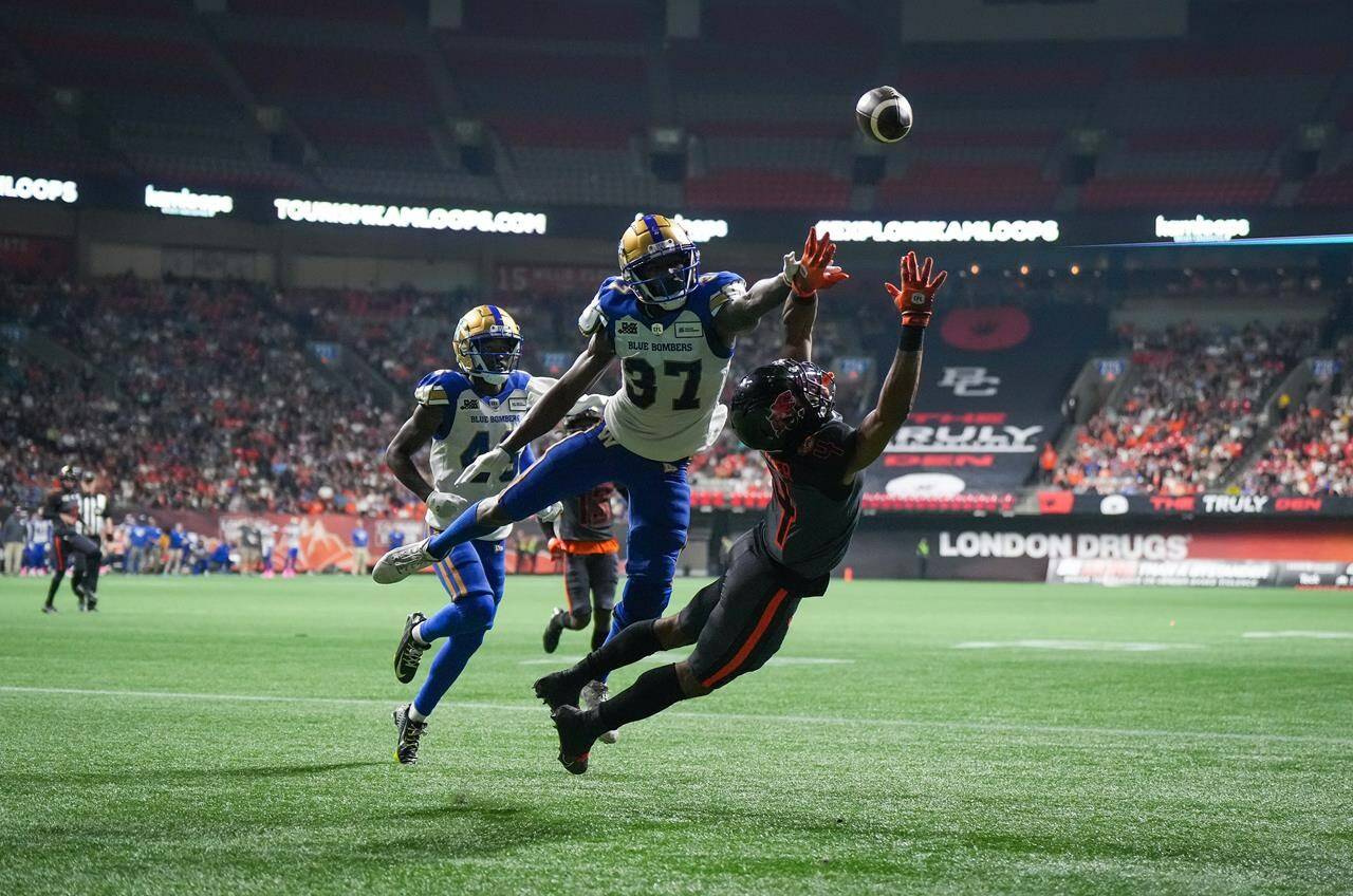 B.C. Lions’ Keon Hatcher (4) fails to make the reception in the end zone as Winnipeg Blue Bombers’ Brandon Alexander (37) defends during the first half of CFL football game in Vancouver, on Saturday, October 15, 2022. THE CANADIAN PRESS/Darryl Dyck