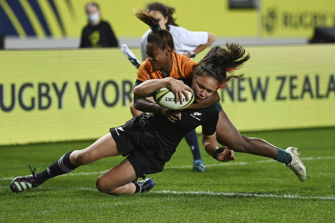 Ruby Tui of New Zealand scores a try during the Women’s Rugby World Cup pool match between Australia and New Zealand, at Eden Park, Auckland, New Zealand, Saturday, Oct.8. 2022. (Andrew Cornaga/Photosport via AP)