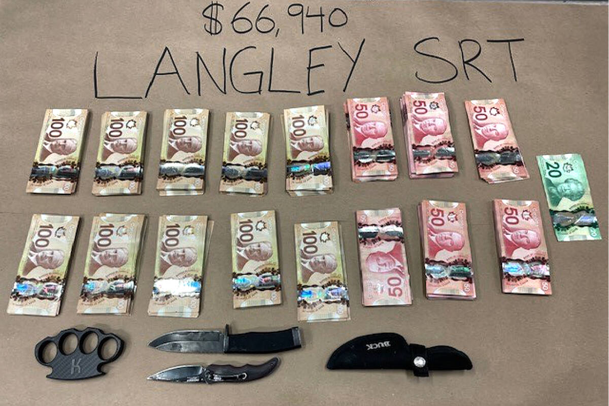 Over $65,000 in cash, weapons and fraudulent ID were seized from a motorist in Langley by the Langley RCMP’s Special Response Team. (RCMP)