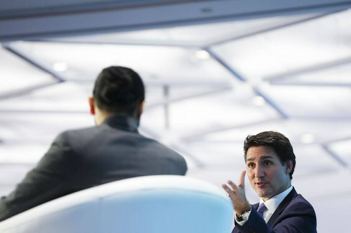 Prime Minister Justin Trudeau participates in a Q-and-A at a net-zero conference in Ottawa on Tuesday, Oct. 18, 2022. Trudeau says he will guarantee that Canada will in fact meet its latest emissions target. THE CANADIAN PRESS/Sean Kilpatrick