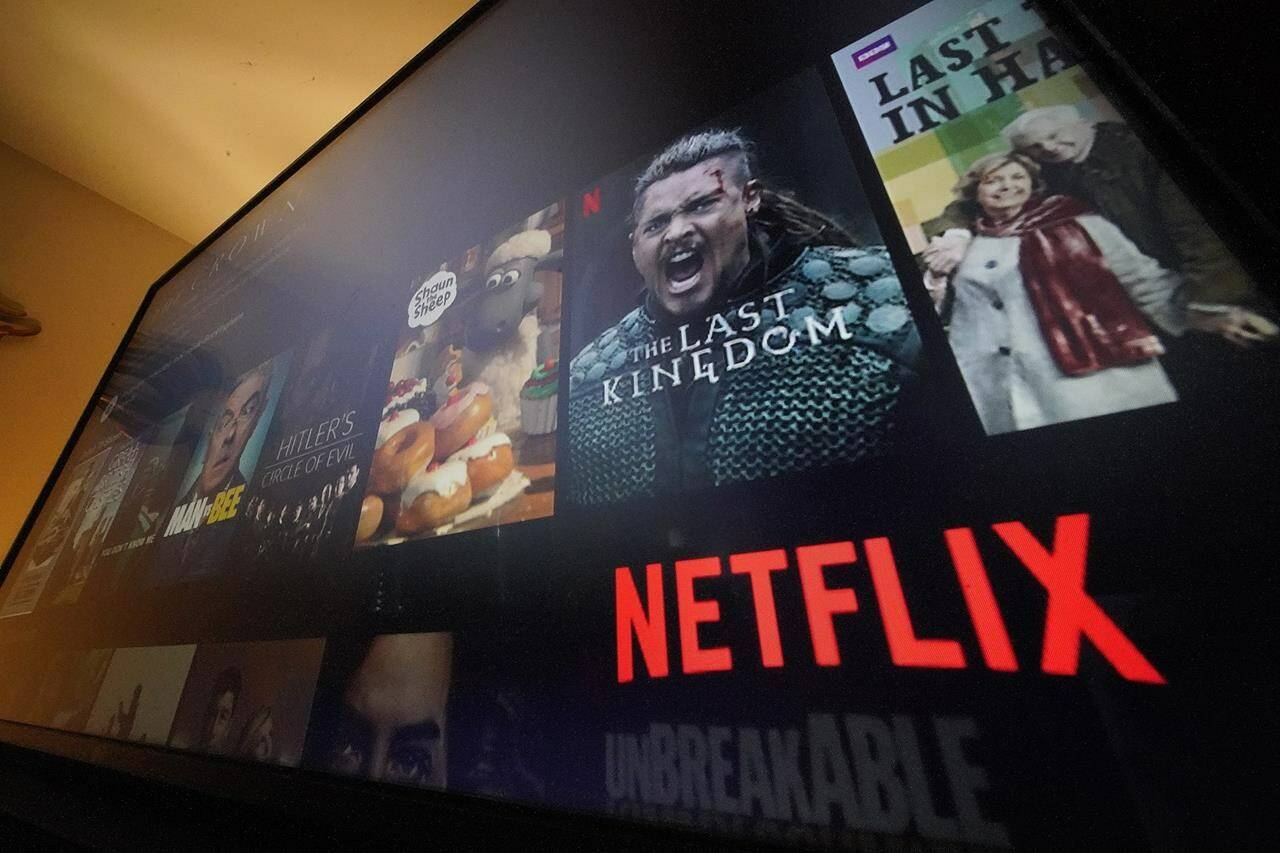 The Netflix menu is shown on a screen in Pittsburgh, on Monday, Oct. 17, 2022. Netflix posted its third quarter results a few weeks before the company launches a cheaper version of its video streaming service that will include ads for the first time, a shift that the company is hoping will accelerate its growth again. (AP Photo/Gene J. Puskar)