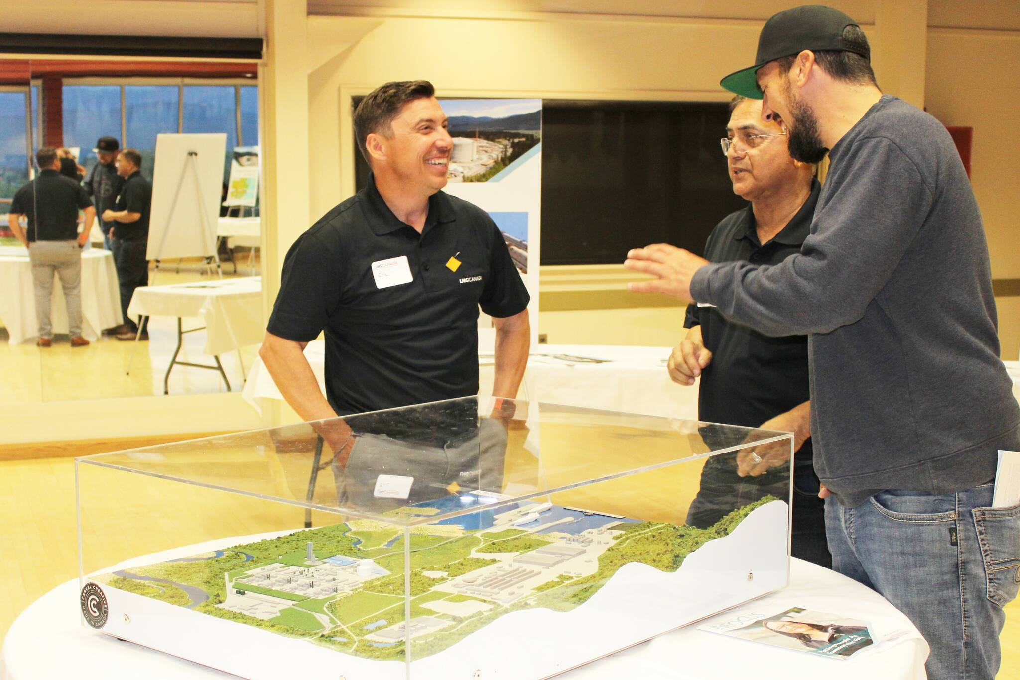 An LNG Canada employee shows off a model of what the natural gas company’s massive terminal in Kitimat will look like once complete. (Michael Bramadat-Willcock/Terrace Standard)