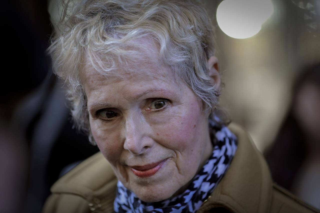 FILE - E. Jean Carroll talks to reporters outside a courthouse in New York on March 4, 2020. Former President Donald Trump was scheduled to answer questions under oath Wednesday, Oct. 19, 2022, in a lawsuit filed by Carroll, a magazine columnist who says the Republican raped her in the mid-1990s in a department store dressing room. (AP Photo/Seth Wenig, File)