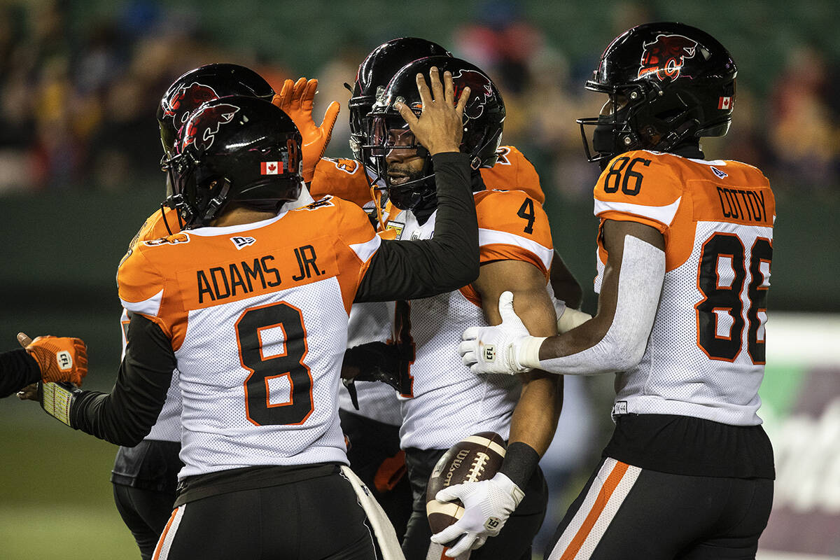 B.C. Lions players celebrate a touchdown against the Edmonton Elks during first half CFL action in Edmonton, Alta., on Friday October 21, 2022. THE CANADIAN PRESS/Jason Franson.