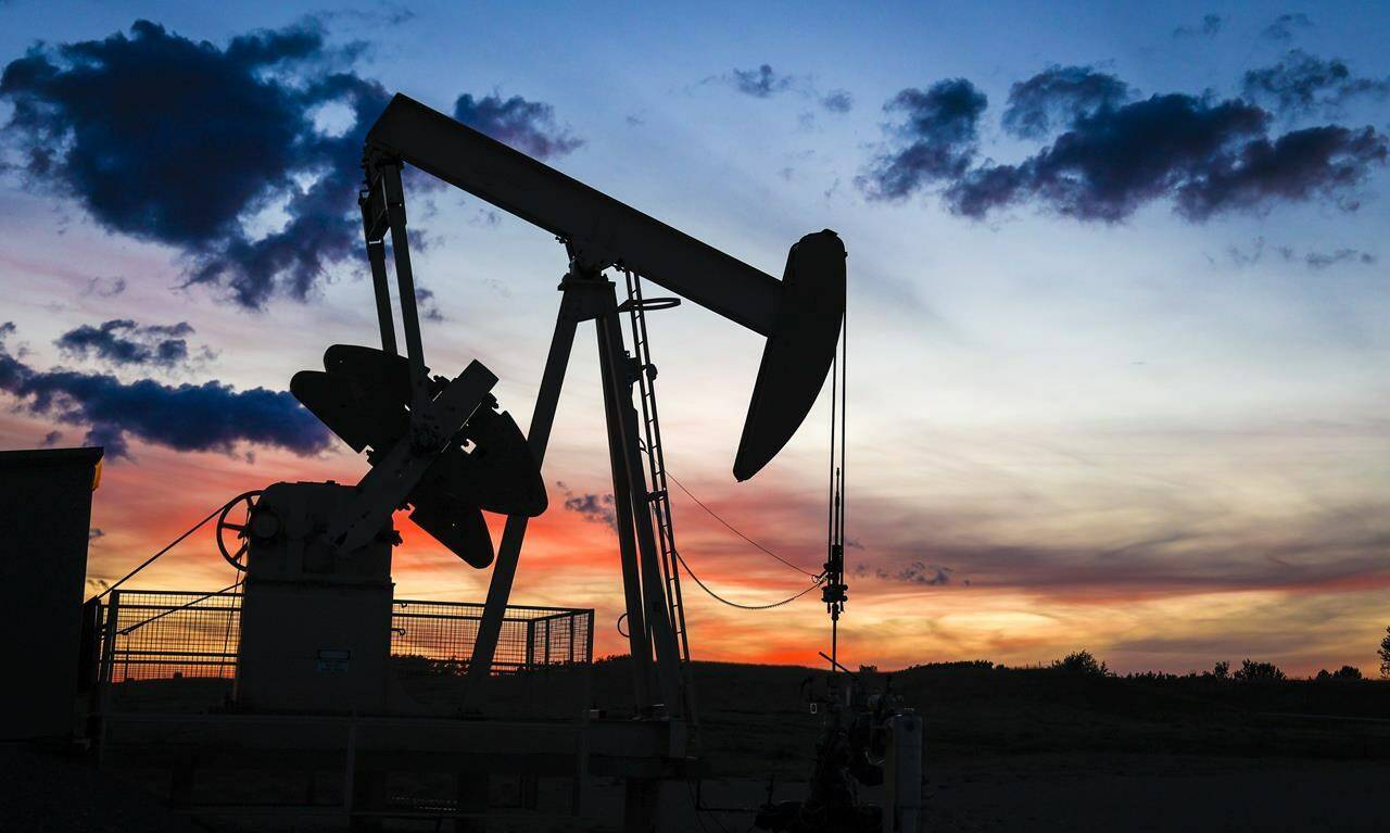 A pumpjack draws out oil from a well head near Calgary, Alta., Saturday, Sept. 17, 2022. In spite of high oil prices and record company profits this year, oil and gas towns aren’t seeing the same level of economic boom they used to a decade ago. THE CANADIAN PRESS/Jeff McIntosh