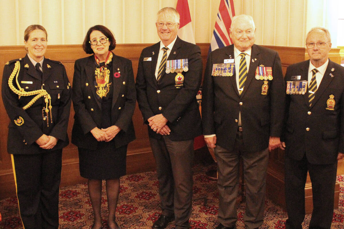 Retired Staff Sgt.-Maj. Kathy Rochlitz (left), Lt.-Gov. Janet Austin, Craig Thompson, Dave Sinclair and Norm Scott pose for a photo after presenting the first poppy at Government House on Oct. 25. (Austin Westphal/News Staff)