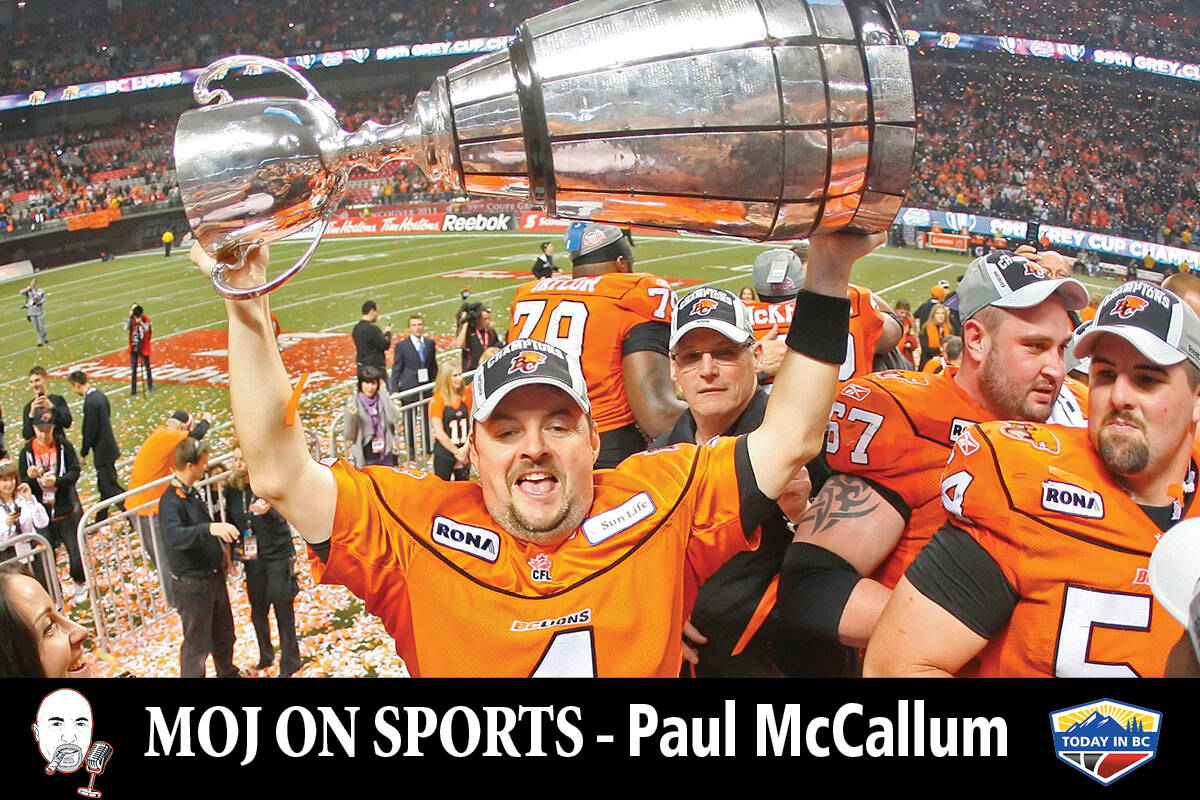 Paul McCallum hoists the Grey Cup as a member of the BC Lions in 2011. (File photo)